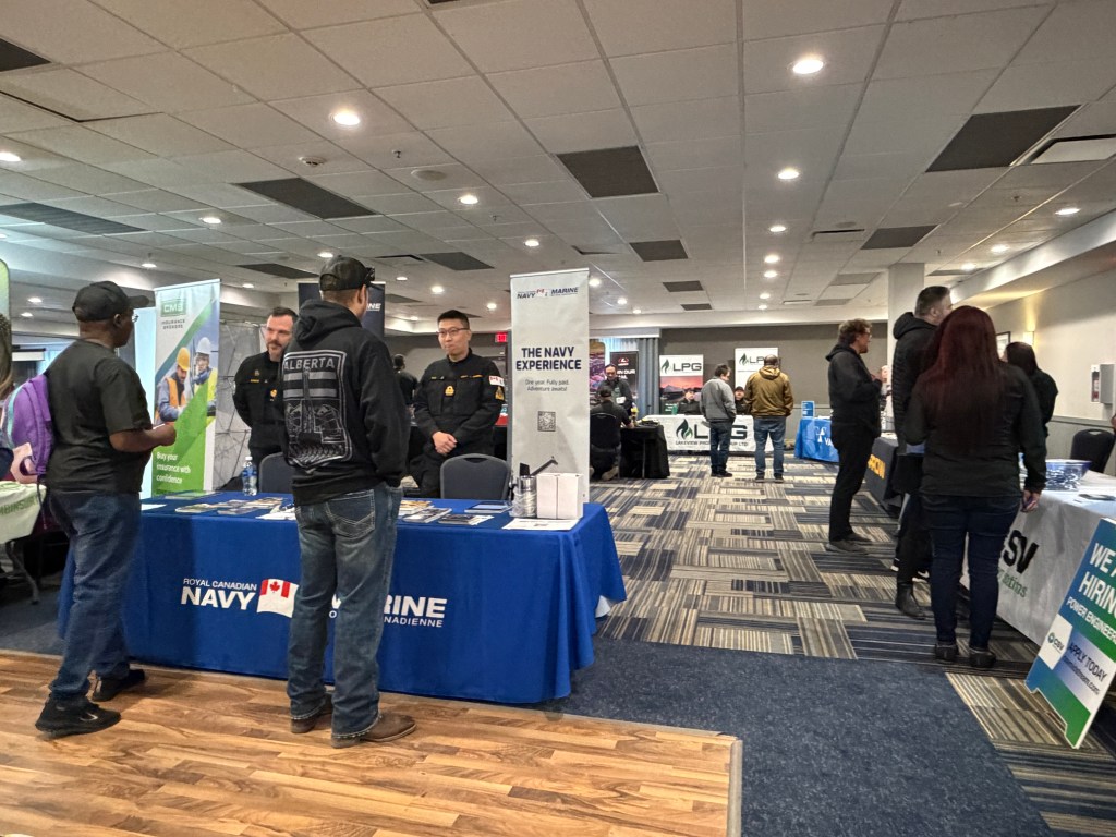 Job seekers talking with recruiters at the Grande Prairie Job Fair